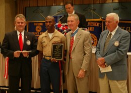Sergeant Nicholas Underwood receives The Exchange Club of Charleston 2005 active duty Marine of the Year award May 19 for his volunteerism along with his outstanding job performance. Underwood was one of the 10 service members to be recognized.