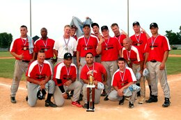 MARINE CORPS BASE CAMP LEJEUNE, N.C. ? The winning team from 2nd Assault Amphibian Battalion poses with the Midnight Madness trophy.