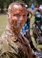 Major Christopher Cerwonka, executive officer, Headquarters and Service Battalion, U.S. Marine Corps Forces Pacific, 'volunteered' for the pie in the face fundraiser, and gladly posed for a photo moments after. The pie auction was one of the many activities held throughout family day June 13, at Bellows Air Force Base.