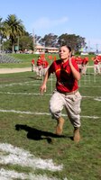 Cpl. Vanessa B. Linares, field radio operator, Bravo Company, 9th Communication Battalion, I Marine Expeditionary Force, sprints during the obstacle portion of Camp Pendleton’s 2010 Leatherneck Field Meet at the 11 Area field, Oct. 27. The Leatherneck Field Meet is a competition for Marines to compete against other units to build camaraderie and esprit de corps.