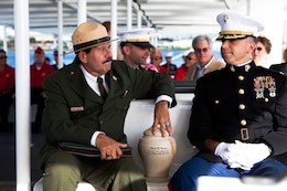 Daniel Martinez (left), a chief historian for Hawaii’s National Park Service, and Col. Nathan Nastase (right), commanding officer of 3rd Marine Regiment, escort Frank R. Cabiness’ urn to the USS Arizona Memorial here Dec. 23 for his interment ceremony. Cabiness was a part of the Marine detachment aboard the USS Arizona and survived the attacks on Pearl Harbor on Dec. 7, 1941.