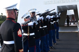Marines from 3rd Marine Regiment conduct a rifle salute to honor Frank R. Cabiness, one of 15 Marine survivors of the attack on the USS Arizona, during an interment ceremony here Dec. 23. Cabiness is only the second Marine to be interred at the memorial.