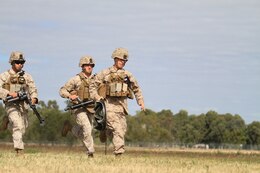 U.S. Marine Corps Lance Cpl. Craig J. Reyes (left), Cpl. Caleb D. Benson (center), and Lance Cpl. Stephan A. Fournier (right), mortarmen with Golf Company, Battalion Landing Team 2nd Battalion 7th Marines, 31st Marine Expeditionary Unit, conduct a weapons drill with a mortar on Camp Rocky during Talisman Saber 2011. TS11 is a biennial combined training activity, designed to train Australian and U.S. forces in planning and conducting Combined Task Force operations to improve Australian Defense Force/U.S. combat readiness and interoperability. It reflects the closeness of the alliance and the strength and flexibility of the ongoing military-military relationship.