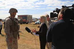 Anna McManamey, a newsreporter for Australian News Channel 7, interviews Cpl. Caleb D. Benson, a mortarman with Golf Company, Battalion Landing Team 2nd Battalion 7th Marines, 31st Marine Expeditionary Unit, after a weapons drill on Camp Rocky during Talisman Saber 2011. TS11 is a biennial combined training activity, designed to train Australian and U.S. forces in planning and conducting Combined Task Force operations to improve Australian Defense Force/U.S. combat readiness and interoperability. It reflects the closeness of the alliance and the strength and flexibility of the ongoing military-military relationship.