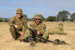 Australian Defense Force Privates James Newton (left) and Peter Noble (right), operator supply, 6th Aviation Regiment, and Craftsman Carl Norling (center), armorer, 6th Aviation Regiment, conduct a weapons drill with a U.S. .50 caliber machine gun on Camp Rocky during Talisman Saber 2011. TS11 is a biennial combined training activity, designed to train Australian and U.S. forces in planning and conducting Combined Task Force operations to improve Australian Defense Force/U.S. combat readiness and interoperability. It reflects the closeness of the alliance and the strength and flexibility of the ongoing military-military relationship.
