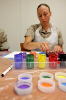 Cpl. Amber Weeks paints a canvas during a Art 4 Healing class at Camp Pendleton's Behavioral and Deployment Health center, Oct. 17. The program is designed to support emotional healing through are and creative expression for those living with pain, grief, fear or stress.