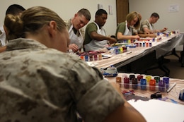 Marines paint canvases during a Art 4 Healing class at Camp Pendleton's Behavioral and Deployment Health center, Oct. 17. The program is designed to support emotional healing through are and creative expression for those living with pain, grief, fear or stress.