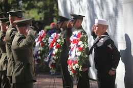 Marine Corps Base Camp Lejeune and Jacksonville city officials lay wreaths at the base of the Beirut Memorial wall in honor of lost troops during the 25th annual Beirut Memorial Observance Ceremony, held at the Beirut Memorial at the Lejeune Memorial Gardens in Jacksonville, N.C., Oct. 23