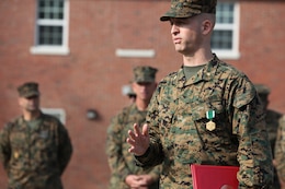 Maj. Matthew D. Reis, the adjutant of Combat Logistics Regiment 2, 2nd Marine Logistics Group, speaks to the Marines and sailors of CLR-2 after an award ceremony aboard Camp Lejeune, N.C., Dec. 11, 2012. Reis received the Navy and Marine Corps Commendation Medal for his exceptional situational awareness and immediate action while responding to a disturbance at a nearby barracks.
