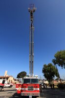 Members of the Camp Pendleton Fire Department escorted spouses up and down the aerial ladder during the Security Battalion's Jane Wayne Day on Camp Pendleton, June 23. The ladder is able to to achieve heights of over 100 meters.