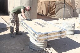 Cpl. Robert G. Sutton, a Field Wireman with Combat Logistics Regiment-15 installs new solar panels aboard Forward Operating Base 
Shukvani, Helmand Province Afghanistan, Nov 19, 2012. The new solar panels are being utilized to power communications equipment in the event of power outages. 