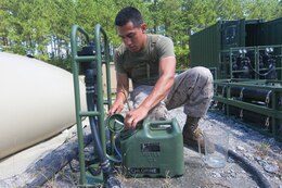 Lance Cpl. Eric D. Rivera, a Houston, Texas native, water purification specialist assigned to Combat Logistics Battalion (CLB) 26, 26th Marine Expeditionary Unit (MEU), tests the chlorine levels in the battalions new lightweight water purification system at Fort Pickett, Va., Sept. 10, 2012. This is the first time the battalion has fielded the purification system, which can pump water from a local water source and filter 450 gallons per hour of clean drinking water. This training is part of the 26th MEU's pre-deployment training program. CLB-26 is one of the three reinforcements of 26th MEU, which is slated to deploy in 2013.