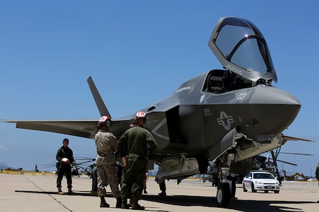 Marines view an F-35B Lightning II from Marine Fighter Attack Squadron 121, Marine Corps Air Station Yuma, Ariz., aboard MCAS Miramar, Calif., July 30. The Lightning II is the Marine Corps' newest aircraft and is capable of short take-off and vertical landing.