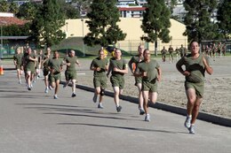 Recruits of Company H, 2nd Recruit Training Battalion, push themselves through the last stretch of their timed three-mile run during the final physical fitness test aboard Marine Corps Recruit Depot San Diego Dec. 27. The final PFT tests recruit's strength and endurance. The score they receive at recruit training will follow them to their first duty station. 