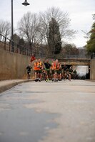 Gunnery Sgt. Alex Brown, faculty advisor, Sergeants Course, Staff Non-Commissioned Officer Academy, leads the road guard of the Sergeants Course during physical training on Jan. 14. The platoon of sergeants ran a 3.5-mile course to tour the base. 