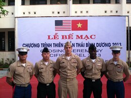 From left to right: Corporal Max Tijerino, 7th Engineer Support Battalion, 1st Marine Logistics Group, Petty Officer 1st Class Lam D. Nguyen, Navy Lt. Thomas V. Brislin and Petty Officer 3rd Class Kirk Bishop, all from 1st Dental Battalion, 1st MLG, and Sgt. Nathan 
Hunt, 7th ESB, stand during the closing ceremony for Pacific Angel 2013. Pacific Angel provided humanitarian civic assistance and 
conducted civil-military operations to areas in need in the Pacific region. 