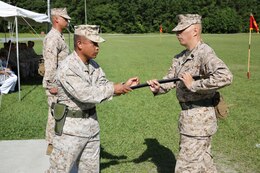 Sgt. Maj. Russell A. Strack (right), the incoming sergeant major of 8th Engineer Support Battalion, 2nd Marine Logistics Group receives the Sword of Office from Lt. Col. Ferdinand F. Llantero (left), during a relief and appointment ceremony held aboard Camp Lejeune, N.C., July 11, 2013. Strack assumed the role of 8th ESB’s sergeant major from 1st Sgt. Monroe C. Boykin during the ceremony.