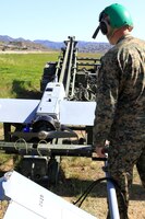 Sgt. Michael Lomartire, an unmanned aerial vehicle technician, preps an RQ-7B Shadow for launch during a training exercise held by Marine Unmanned Vehicle Squadron 4 at Camp Talega, here Feb. 27.