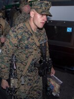 Cpl. John Dorben, assaultman assigned to Battalion Landing Team 3/2, 26th Marine Expeditionary Unit, arrives at Naval Station Norfolk, Va., March 10, 2013, in order to board the USS Kearsarge (LHD 3) for their deployment. The 26th MEU is deploying to the 5th Fleet and 6th Fleet areas of operation. The MEU operates continuously across the globe, providing the president and unified combatant commanders witha  a forward-deployed, sea-based, quick-reaction force. The MEU is a Marine Air-Ground Task Force capable of conducting amphibious operations, crisis-response and limited contigency operations.