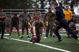 A Sailor with 2nd Marine Logistics Group kicks a football during a field goal challenge at the unit’s field meet aboard Camp Lejeune, N.C., May 1, 2013. Marines and sailors competed with each other in flag football, softball, soccer and volleyball throughout the day’s festivities