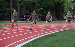 Marines with 2nd Marine Logistics Group race each other during a track and field event at the unit’s field meet aboard Camp Lejeune, N.C., May 1, 2013. Each Marine was representing a different company or battalion and competed to be best in the MLG.