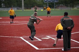 A Marine with 2nd Marine Logistics Group swings at a softball during a softball game at the unit’s field meet aboard Camp Lejeune, N.C., May 1, 2013. After all sport matches were completed, the top teams competed for the championship round.