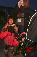 Aoi Kantani, 3, poses for a photo after she finishes trick-or-treating in the Monzen housing area aboard Marine Corps Air Station Iwakuni, Japan, during the Halloween Festival Oct. 31, 2013. Between 5-7 p.m., 302 visitors came aboard station for the Halloween experience.
