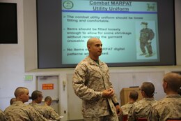 Sgt. Carlos E. Arguello, Academics Instructor, Instructional Training Company, explains to recruits how importannt it is to maintain their uniforms during a Marine Corps uniform class Oct. 2. 
