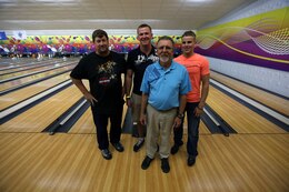 Steve Fredrickson, Nick Page, Mike Sullivan and Caleb Johnson, the Nine-pin No Tap Tournament Men’s Division semi-finalists, stand together after the tournament at the Bonnyman Bowling Center aboard Marine Corps Base Camp Lejeune, Oct. 19. Sullivan out-bowled Fredrickson 235 to 207 in the finals for the win.