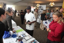 Marines, veterans and spouses get face-to-face with employers during the Marine Corps Air Station New River job fair, Sept. 5. Marine Corps Community Services aboard the air station hosted the job fair at the Officer's Club. There were 34 employers in attendance.  
