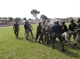 Nigerian soldiers practice riot control techniques taught to them by Marines with Special-Purpose Marine Air-Ground Task Force Africa 14.1 during a training exercise, March 19. The group of four Marines trained approximately 20 Nigerian soldiers on basic non-lethal weapons techniques in support of U.S. Africa Command and Marine Corps Forces Europe and Africa’s theater security cooperation requirements.