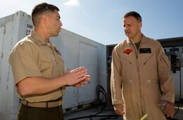 Capt. Odon Garcia, left, avionics officer with Marine Aviation Logistics Squadron 11, speaks with Col. Robert Boyles, right, incoming commanding officer for Marine Fighter Attack Training Squadron 101, before an inauguration ceremony aboard Marine Corps Air Station Miramar, Calif., March 28. Garcia introduced his squadron’s newest radar repair capability to the commanding officer of Marine Aircraft Group 11, Col. Rick, Uribe and other distinguished guests.
