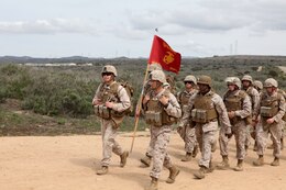 Marines with Headquarters and Support Company, Combat Logistics Battalion 5, Combat Logistics Regiment 1, 1st Marine Logistics Group, conduct a combat conditioning hike to the Leadership Reaction Course aboard Camp Pendleton, Calif., April 4, 2014. After completing the hike and an obstacle course, the Marines divided into teams and split between 12 stations. The course is designed to build leadership traits and further develop the bonds between Marines. (U.S. Marine Corps photo by Lance Cpl. Keenan Zelazoski/ Released)
