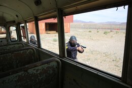 Officers with Marine Corps Logistics Base Barstow’s Marine Corps Police Department practice clearing during an active shooter exercise here, April 9. The purpose of the training was to hone and develop MCPD officer’s skills on responding to active shooter incidents.