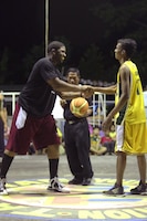 A Filipino shakes hands with an American basketball player prior to the tip-off of a Barangay Tamaoyan Friendship basketball game April 24 during Exercise Balikatan 2014 in Legazpi City, Albay Province, Philippines. Basketball, one of the most popular sports in the Philippines, provided the local community and U.S. service members with the opportunity to interact and get to know one another on a personal level. Balikatan is an annual bilateral exercise between the Armed Forces of the Philippines and U.S. armed forces designed to strengthen interoperability and country-to-country relations.