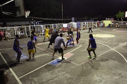 Photo by Lance Cpl. Trever Statz


The Tamaoyan and U.S. service member teams play together at the Barangay Tamaoyan Friendship basketball game April 24 during exercise Balikatan 2014 in Legazpi City, Albay Province, Philippines. Basketball, one of the most popular sports in the Philippines, provided the local community and U.S. service members with the opportunity to interact and get to know one another on a personal level. Balikatan is an annual bilateral exercise between the Armed Forces of the Philippines and U.S. armed forces designed to strengthen interoperability and country-to-country relations. 