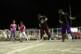 Local residents, left, dance with U.S. service members during the second quarter show at the Barangay Tamaoyan Friendship Basketball Game April 24 during Exercise Balikatan 2014 in Legazpi City, Albay Province, Philippines. Basketball, one of the most popular sports in the Philippines, provided the local community and U.S. service members with the opportunity to interact and get to know one another on a personal level. Balikatan is an annual bilateral exercise between the Armed Forces of the Philippines and U.S. armed forces designed to strengthen interoperability and country-to-country relations.