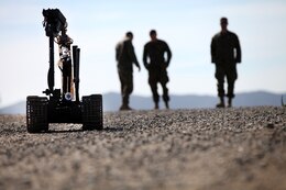 Marines with 1st Explosive Ordnance Disposal Company, 7th Engineer Support Battalion, observe as the TALON Mark II robot attempts to pick up a block during pre-deployment training aboard Camp Pendleton, Calif., Feb, 18, 2014. The Marines with 1st EOD have been training since September of last year in preparation for their upcoming deployment to Afghanistan next month in support of Operation Enduring Freedom.