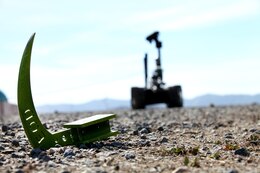 The TALON Mark II robot attempts to pick up a metal object during pre-deployment training aboard Camp Pendleton, Calif., Feb, 18, 2014. The Marines with 1st EOD have been training since September of last year in preparation for their upcoming deployment to Afghanistan next month in support of Operation Enduring Freedom. 