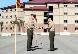 Lieutenant Col. John O’Neal, left, commanding officer, 15th Marine Expeditionary Unit, presents the noncommissioned officer’s sword to Sgt. Maj. Douglas B. Schaefer, signifying the transfer of enlisted authority as the 15th Marine Expeditionary Unit Sergeant Major during a relief and appointment ceremony aboard Camp Pendleton Calif., Feb. 21, 2014. (U.S. Marine Corps photo by Cpl. Emmanuel Ramos/Released)