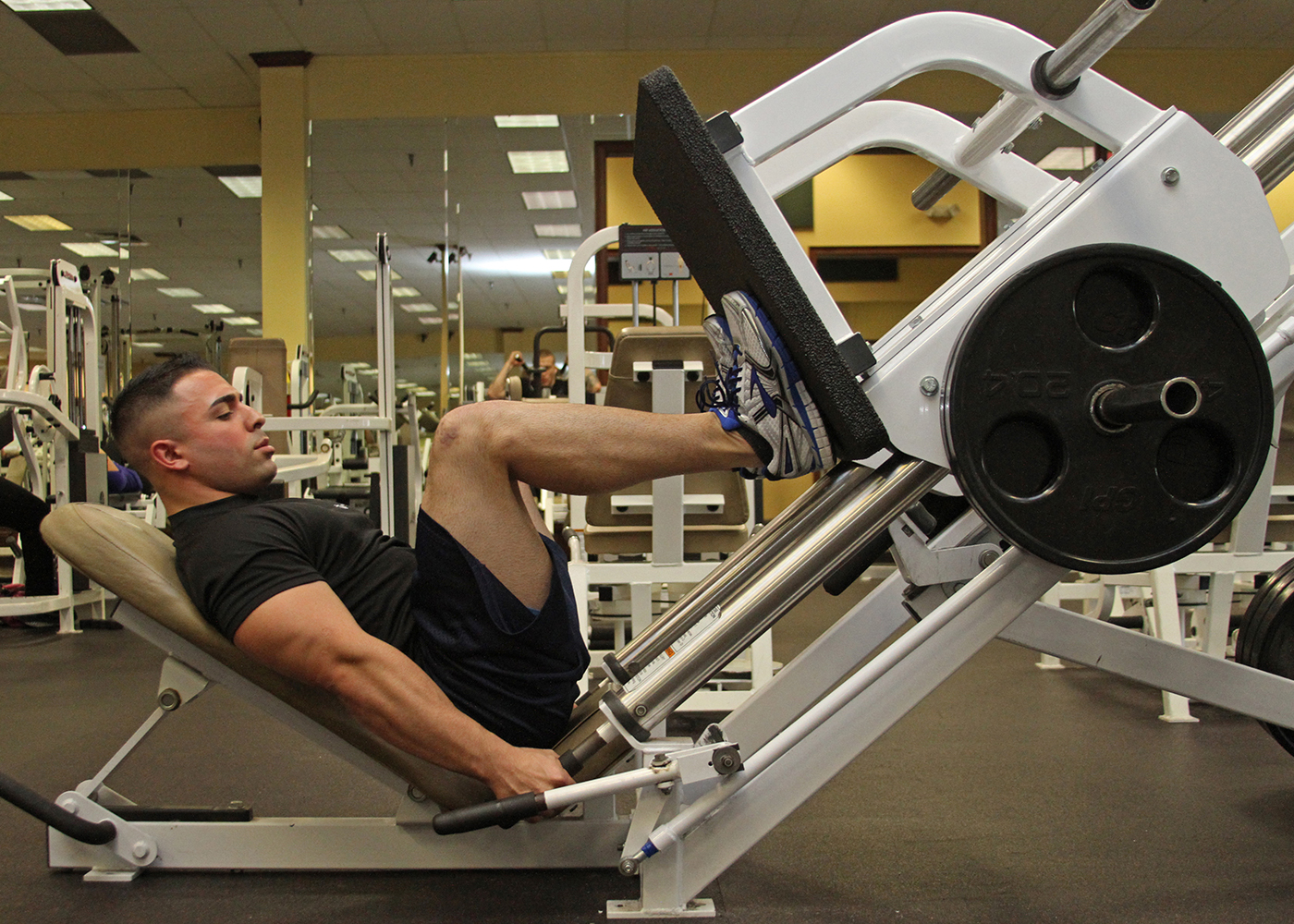 Sgt. Landon Rios, a canvassing recruiter with Recruiting Substation Augusta, Recruiting Station Columbia, performs a leg press exercise at Gold’s Gym on Dec. 17 in Augusta, Ga. Rios required emergency knee surgery following a motorcycle accident at this location on June 20. (Marine Corps Photo by Sgt. Aaron Rooks) 