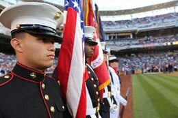 The 11th Marine Expeditionary Unit's color guard lines up along the baseball field before the Padres' pre-game ceremony here, Aug. 2, 2013. The 11th MEU's color guard performed precision drill and honors to the colors during the pre-game ceremony.(Photo courtesy of Cpl. Demetrius Morgan)