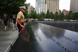 Brigadier Gen. Vincent Coglianese, 1st Marine Logistics Group Commanding General, looks out at the 9/11 World Trade Center Memorial fountain before going on a tour of the 9/11 Museum in New York City, June 25, 2014. Brigadier Gen. Coglianese traveled to New York to officiate Col. James Maxwell’s retirement ceremony Maxwell, a New York State trooper and Marine, served 32 in the Marine Corps. During his career he served in Operation Desert Shield, Operation Desert Storm and Operation Enduring Freedom.