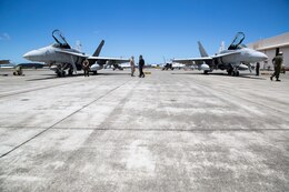 Marines with Marine Fighter Attack Squadron 122 prepare F/A-18C Hornets for a flight during the Rim of the Pacific 2014 aboard Marine Corps Base Hawaii, July 2. RIMPAC is a multinational maritime exercise held every two year by the U.S. Pacific Fleet. VMFA-122, based out of Marine Corps Air Station Beaufort, S.C., is currently part of the Unit Deployment Program under Marine Aircraft Group 12, based out of MCAS Iwakuni, Japan.