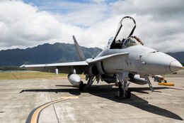 A pilot with Marine Fighter Attack Squadron 122 climbs into an F/A-18C Hornet before a flight during the Rim of the Pacific Exercise 2014 aboard Marine Corps Base Hawaii, July 2. Rim of the Pacific is a multinational maritime exercise held every two years by the U.S. Pacific Fleet. VMFA-122, based out of Marine Corps Air Station Beaufort, S.C., is currently part of the Unit Deployment Program under Marine Aircraft Group 12, based out of MCAS Iwakuni, Japan.