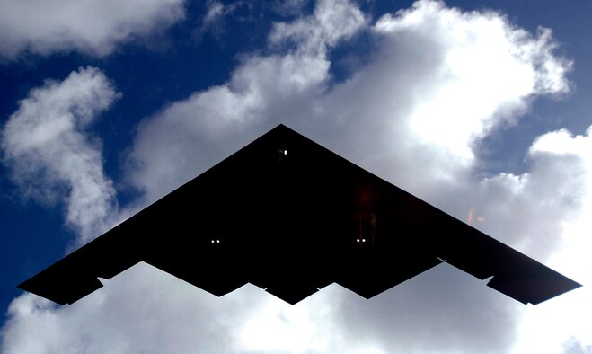 A B-2 Spirit flies over Andersen Air Force Base, Guam. First flight of the B-2 took place July 17, 1989. Air Force Research Laboratory investment in technologies like integrated avionics, radar and low-observables maintainability helped field the B-2. (U.S. Air Force photo/Airman 1st Class Michael S. Dorus)