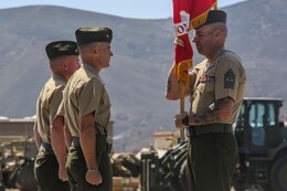 Sergeant Maj. Daniel Krause, the sergeant major for 1st Combat Engineer Battalion, 1st Marine Division, presents the battle colors to Lt. Col. Andrew Winthrop, the 1st CEB former commanding officer, at the change of command ceremony aboard Camp Pendleton, Calif., June 18, 2014. Winthrop served as the 1st CEB commanding officer for 18 months.