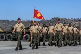 Captain Adjoran Ferenczy, the company commander of Company C, 1st Combat Engineer Battalion, 1st Marine Division, leads the formation into position for the 1st CEB change of command ceremony aboard Camp Pendleton, Calif., June 18, 2014. At the ceremony Lt. Col. Andrew Winthrop, the former commanding officer of 1st Combat Engineer Battalion, 1st Marine Division relinquished command of the battalion to Lt. Col. Colin Smith.