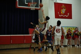 David, a sophomore at the Quantico Middle/High School, attempts a layup during a home game against St. Michael the Archangel High School of Fredericksburg on Jan. 27, 2014. The Quantico Warriors won 65-52.