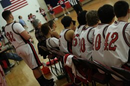 The Quantico Middle/High School basketball bench watches their teammates during their home game against St. Michael the Archangel High School of Fredericksburg on Jan. 27, 2014. The Quantico Warriors won 65-52. 